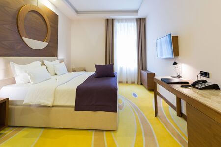 Bedroom in modern hotel room interiorの写真素材