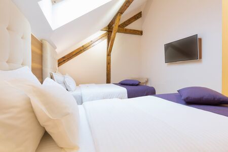 Hotel bedroom interior in the loft apartment