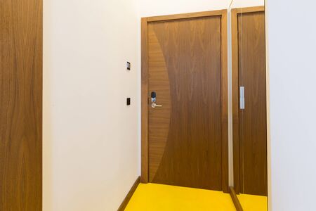 Wooden door in hotel roomの写真素材