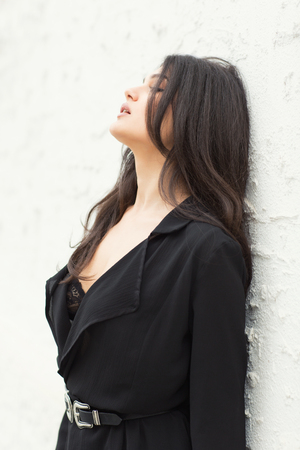 Portrait of beautiful woman, model, wearing black dressの写真素材