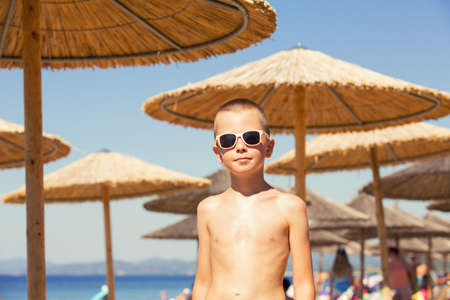 Young boy on vacation by the seaの写真素材