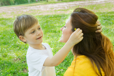 Mother and son enjoying together in the parkの写真素材