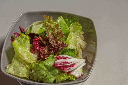 Mixed green salad in a bowl