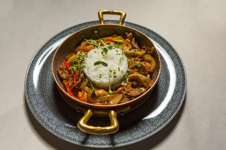 Szechuan beef served with rice in the restaurantの写真素材