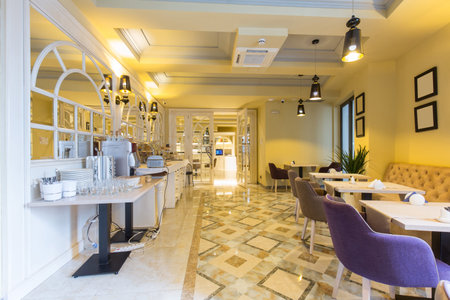 Interior of a  hotel restaurant with buffet tableの写真素材