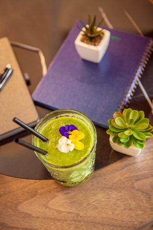 Green smoothie on the restaurant tableの写真素材