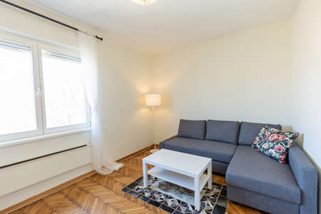 Interior of a living room with wooden parquet floorの写真素材