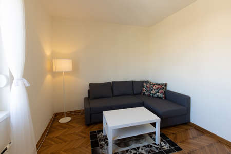 Interior of a living room with wooden parquet floorの写真素材