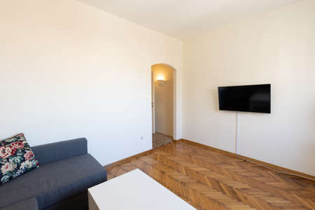 Interior of a living room with wooden parquet floorの写真素材