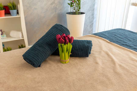 Towels on massage bed in spa centerの写真素材