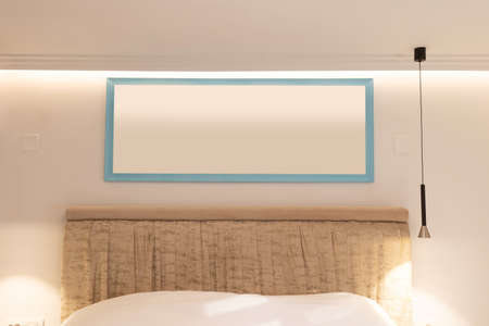 Bedroom wall with painting mockupの写真素材