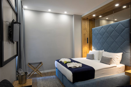 Interior of a double bed hotel bedroomの写真素材
