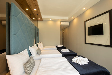 Interior of a double bed hotel bedroomの写真素材