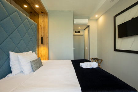Interior of a double bed hotel bedroomの写真素材