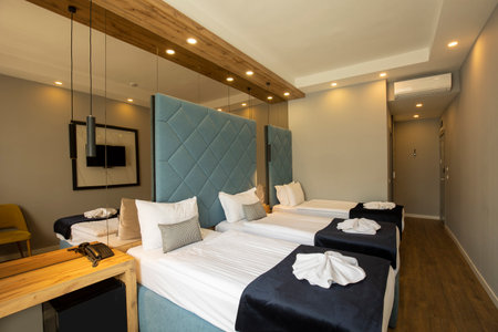 Interior of a double bed hotel bedroomの写真素材