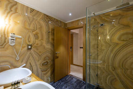Interior of a luxury hotel bathroom with marble wallsの写真素材