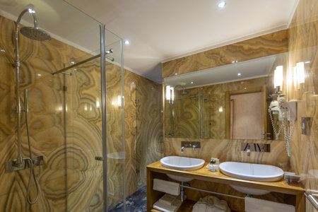 Interior of a luxury hotel bathroom with marble wallsの写真素材