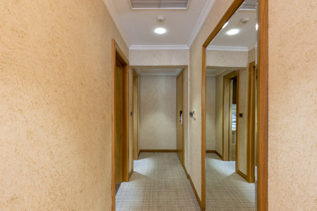 Interior of a hotel corridor with doors with room nummbersの写真素材