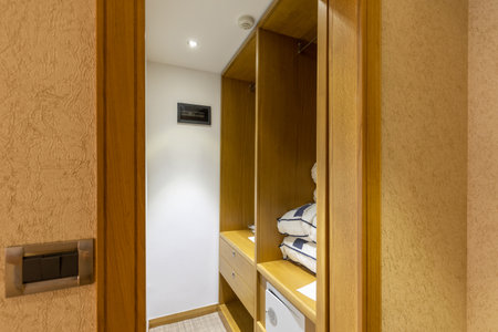 Closet with safe deposit box in hotel roomの写真素材