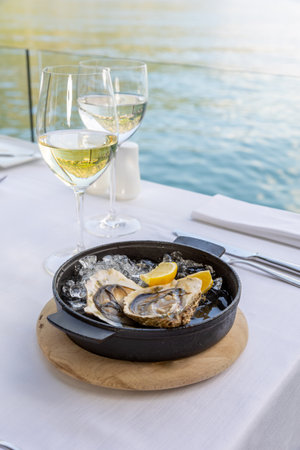 Mussels served on a plate in sea food restaurant by the seaの写真素材