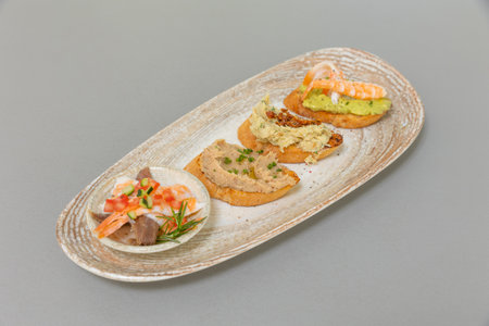 Seafood bruschetta served on a plateの写真素材