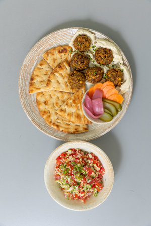 Falafel served with bread and vegetablesの写真素材