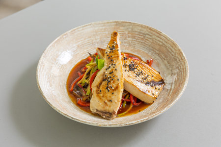 Fried fish served with vegetablesの写真素材