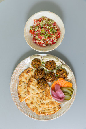 Falafel served with bread and vegetablesの写真素材