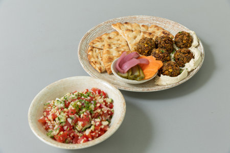 Falafel served with bread and vegetablesの写真素材