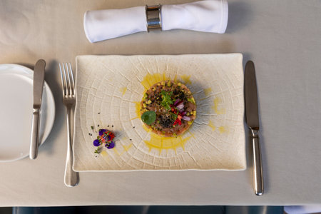 Raw salmon with avocado served in the restaurantの写真素材