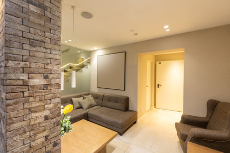 Interior of a modern hotel apartment with brick wall decorationの写真素材