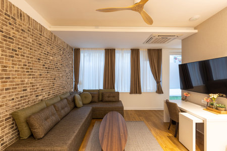 Interior of a modern hotel apartment with brick wall decorationの写真素材