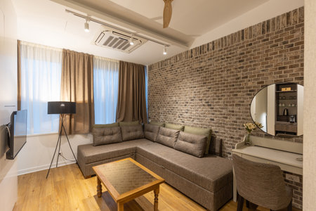 Interior of a modern hotel apartment with brick wall decorationの写真素材