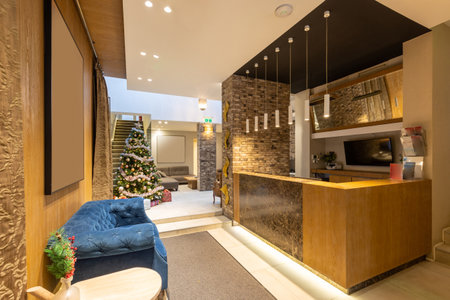 Christmas decorated hotel lobby with reception deskの写真素材