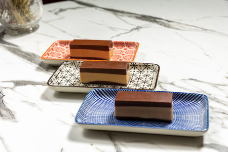 Nougat praline, delicious mix of nougat and almond creme chocolate served on a plate