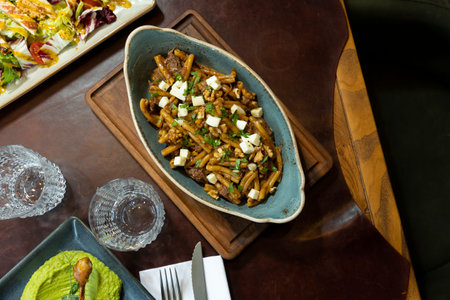 Pasta with meat and goat cheese