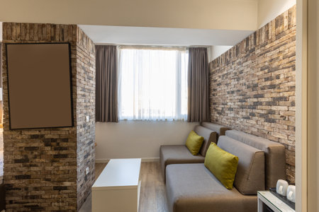 Interior of a modern hotel apartment with brick wall decorationの写真素材