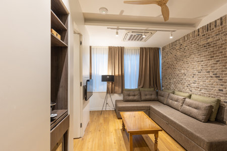 Interior of a modern hotel apartment with brick wall decorationの写真素材