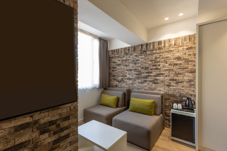Interior of a modern hotel apartment with brick wall decorationの写真素材