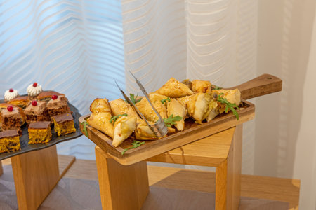 Food served on a banquet table in a meeting roomの写真素材