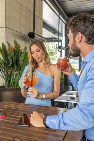 Unsatisfied couple standing and drinking in a cocktail barの写真素材