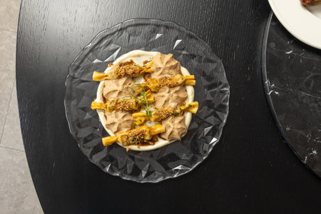 Hazelnut dessert served on a glass plateの写真素材