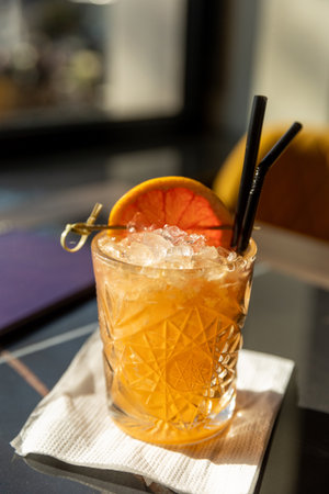 Orange cocktail served in a bar