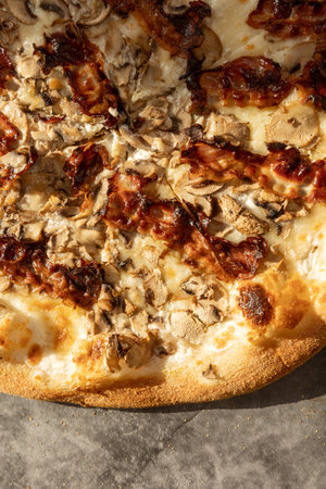 Top view of bacon pizza served in the restaurantの写真素材