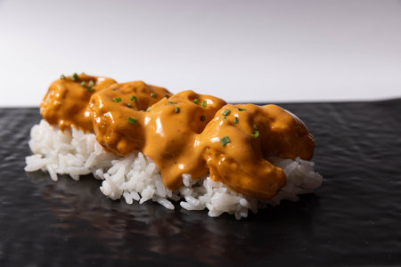 Salmon skin sushi roll served on a black stone, top viewの写真素材