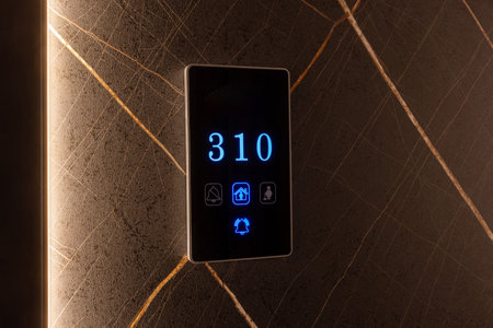 Hotel room number mounted on a wallの写真素材