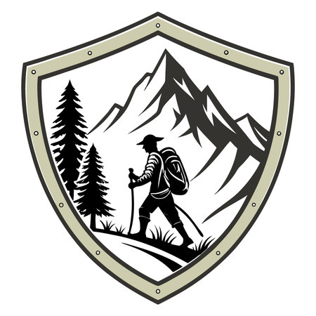 A shield emblem showcases a hiker trekking through a mountain landscape with trees, symbolizing adventure and resilience.のイラスト素材