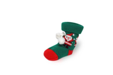 Christmas knitted sock on white backgroundの写真素材