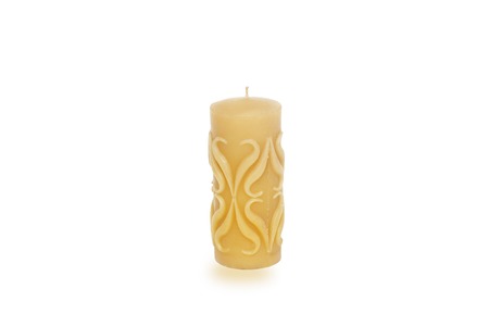 Natural wax candle isolated on a white backgroundの写真素材