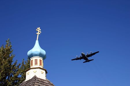 American military plain flying over Russian Orthodox church in Alaska